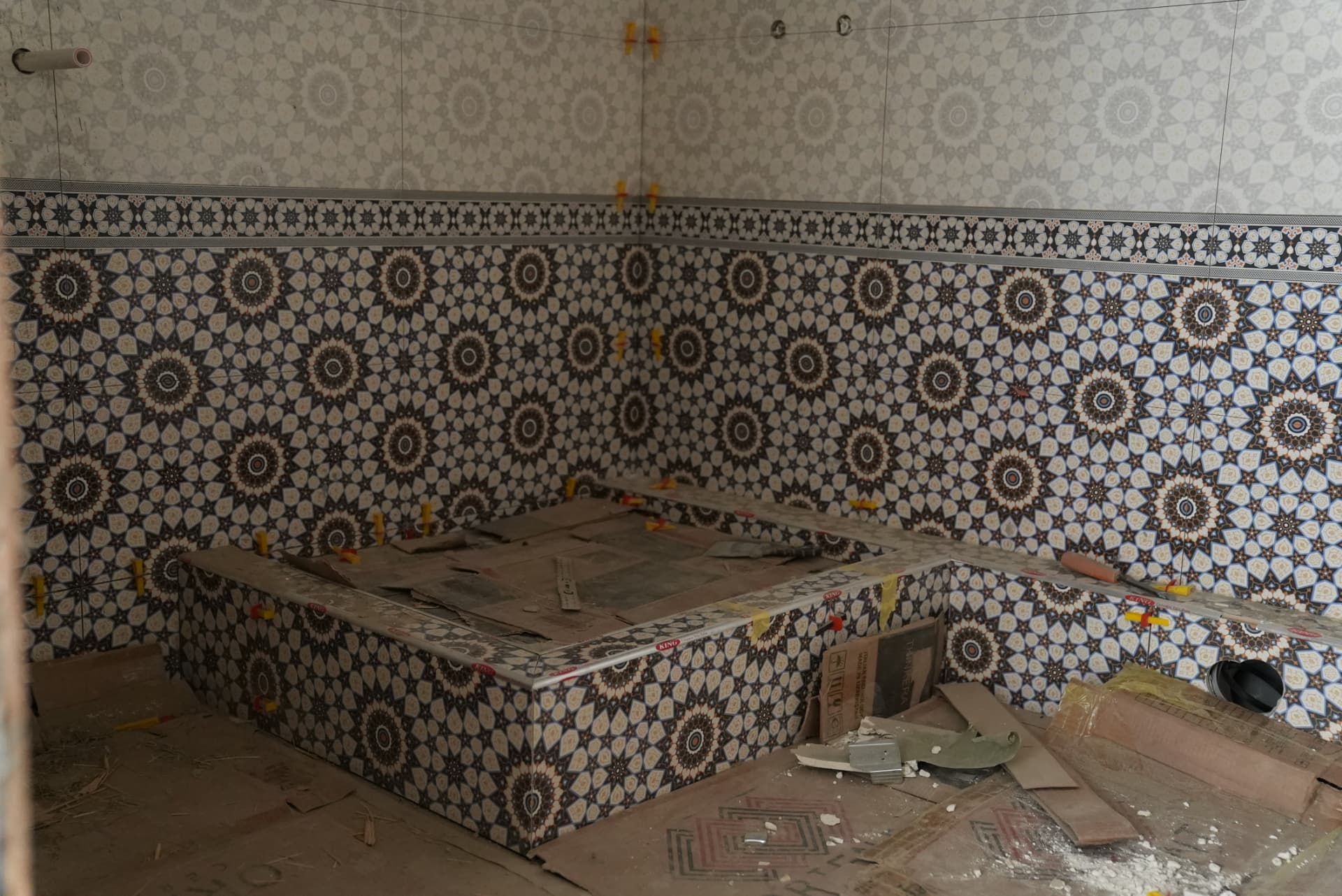 Bathroom tiled in geometric Uzbek-style patterns