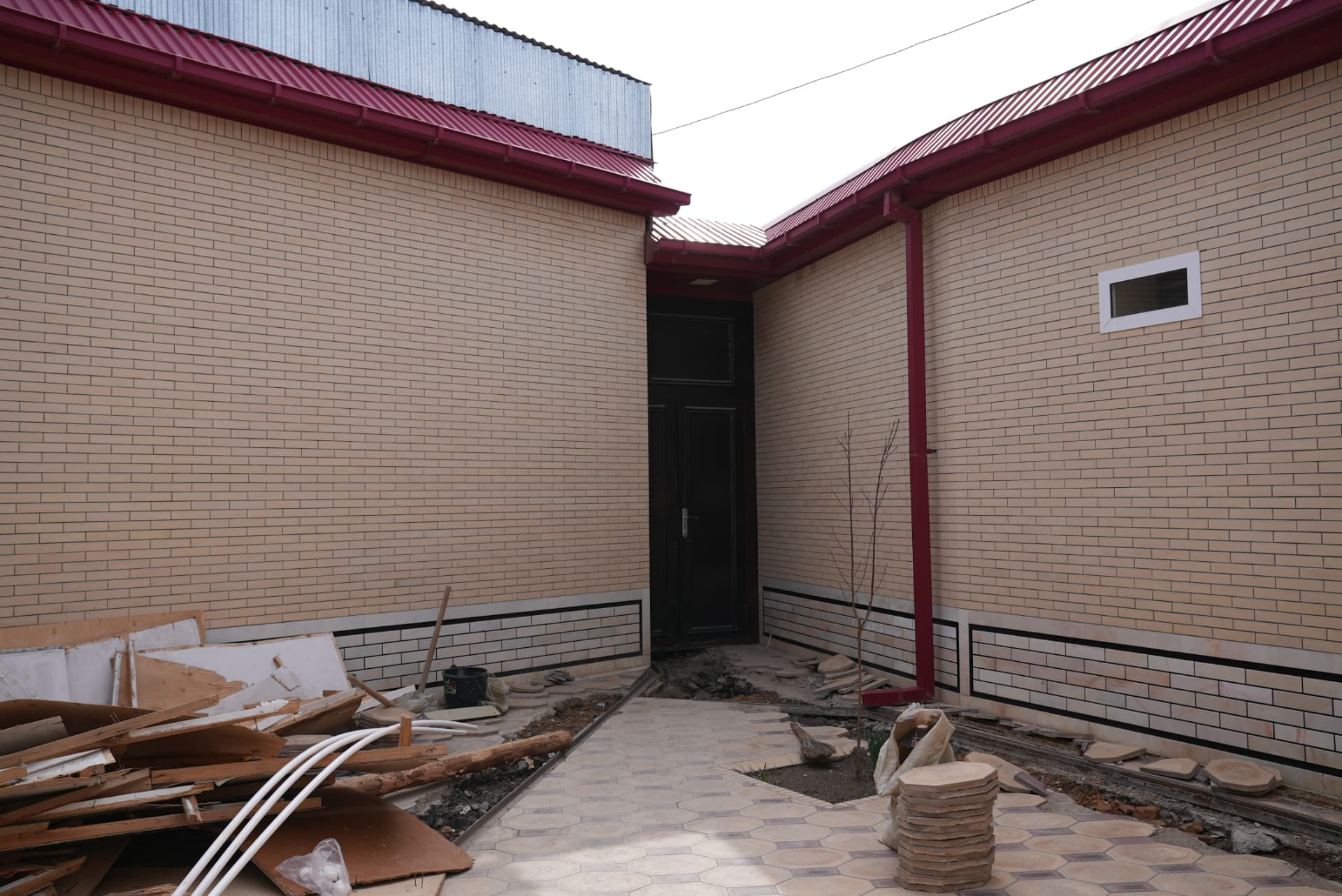 The courtyard with its Persian-style brickwork and trees