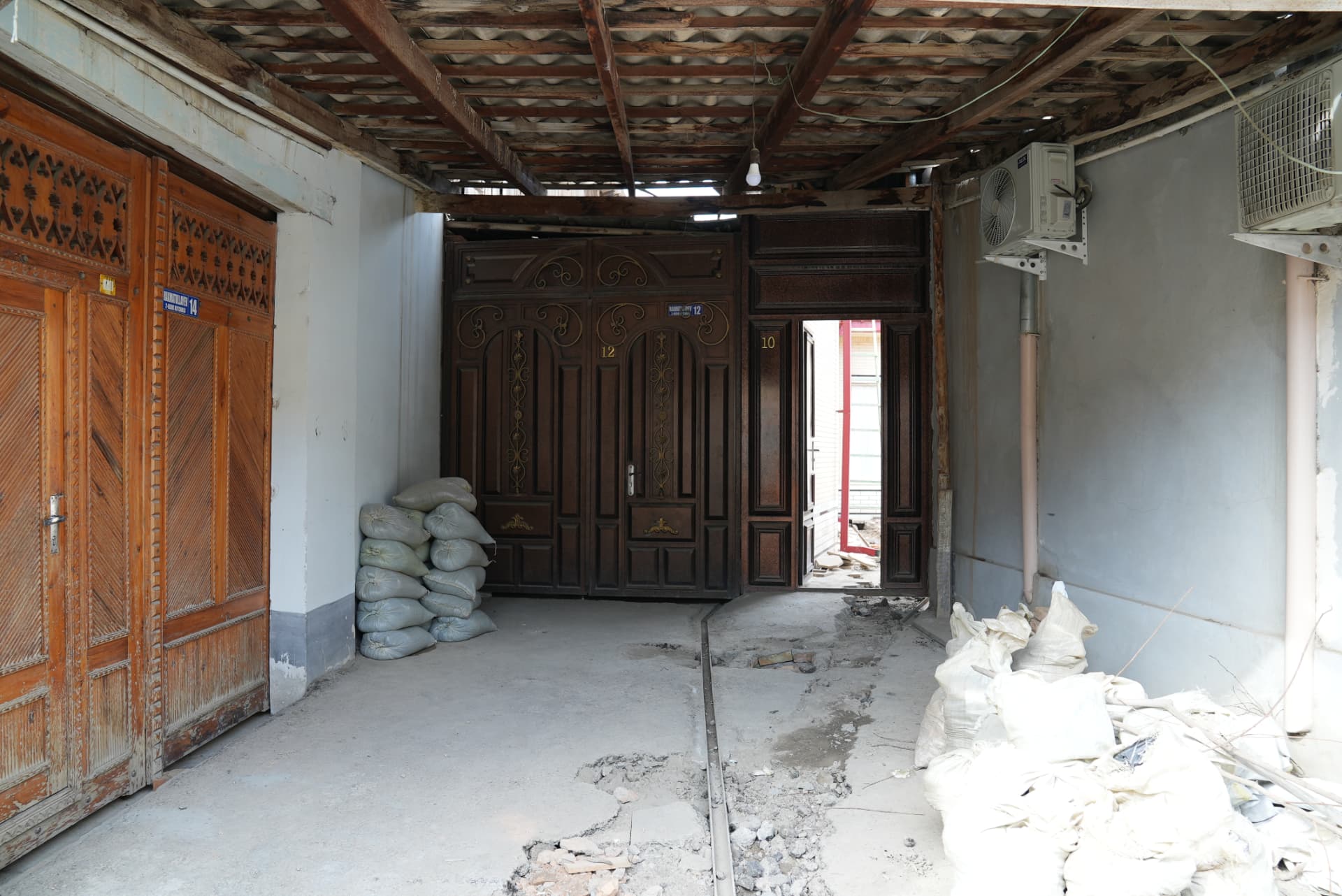 Carved wooden doors in the covered passage