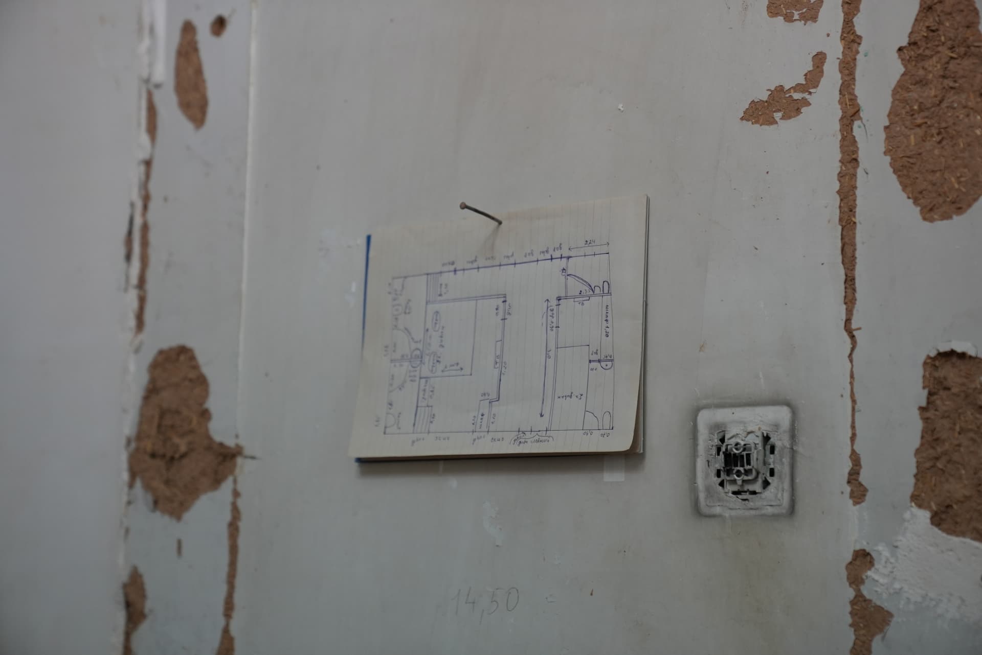 The hand-drawn plan taped to the wall, guiding every decision on site