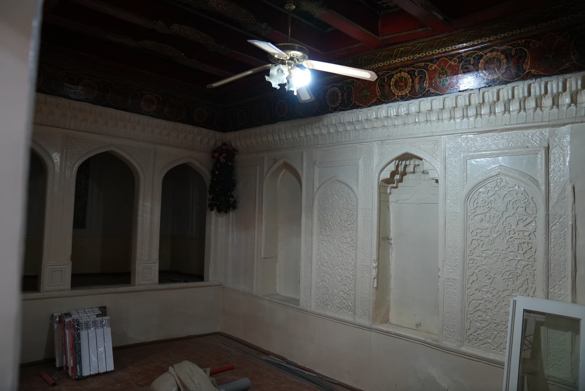 The carved walls and arched niches of the room we call Registan